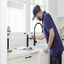 plumber-fixing-the-faucet