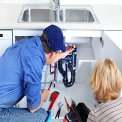 plumber-fixing-the-pipe-under-the-sink