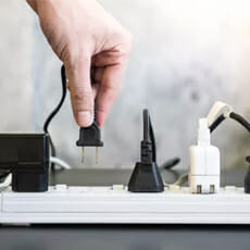 hand-pulling-the-appliances from outlets