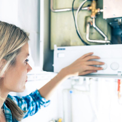 woman-checking-the-water-heater