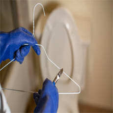 cutting a wire coat hanger