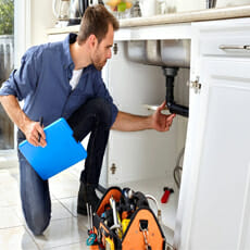 man-checking-water-pipe