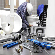 plumber with plumbing-tools