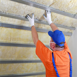 A man working on the insulation