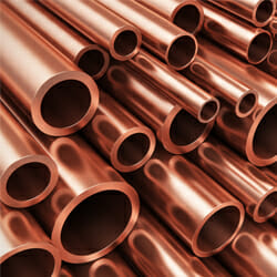 a pile of copper pipes