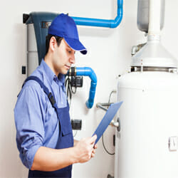 a man checks the hot water system