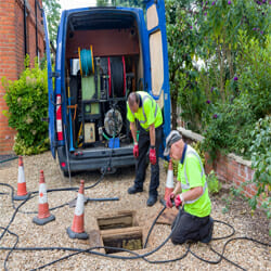 plumbers fixing the blocked drains