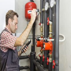 A plumber measured the temperature using a sensor.