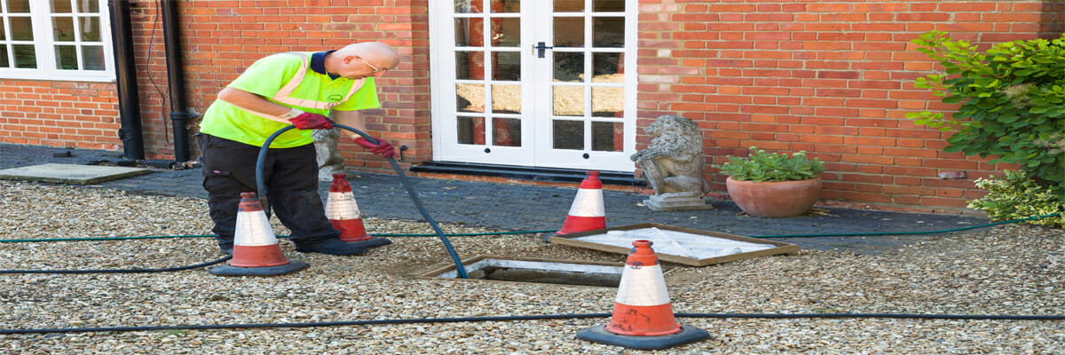 a man preventing drain blockages