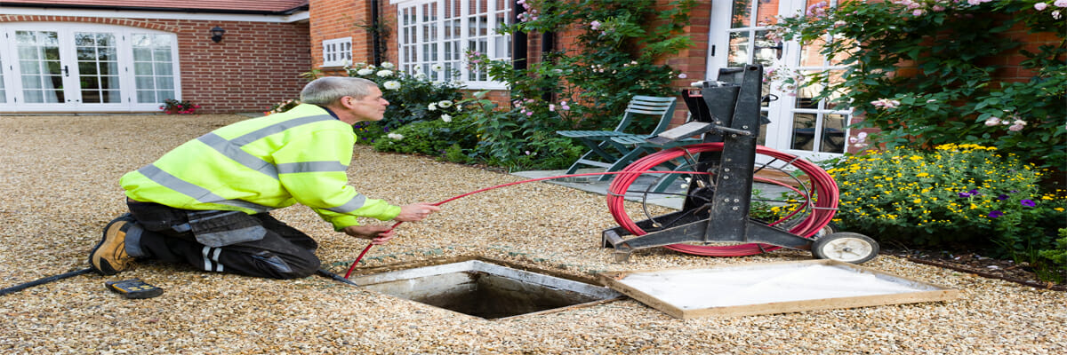 plumber fixing the gurgling drains